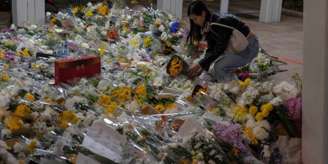Hong Kong Remembers Fire Victims as Investigators Search for Remains